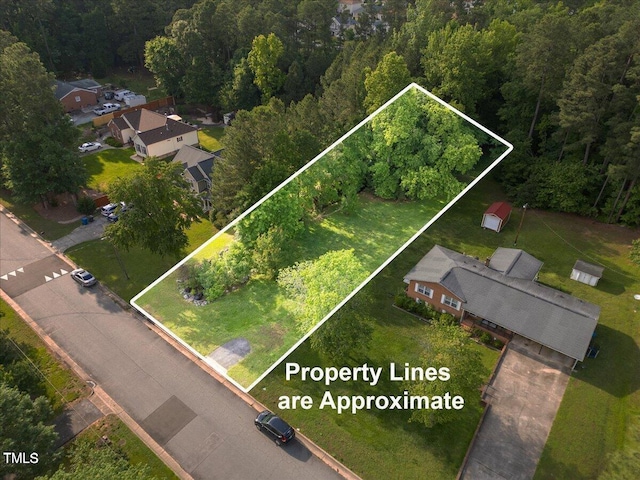 311 Ebon Rd, Durham, NC 27713 - view of property location with property boundaries highlighted and a heavily wooded area