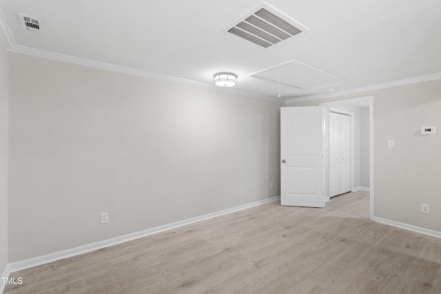 2705 Crest St Unit 3, Durham, NC 27705 - spare room featuring attic access, crown molding, and light wood finished floors