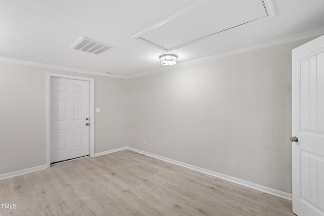 2705 Crest St Unit 3, Durham, NC 27705 - spare room with attic access, light wood-style floors, and ornamental molding