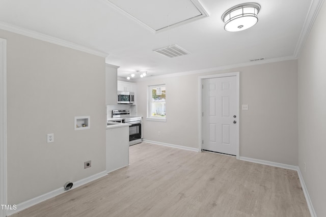 2705 Crest St Unit 3, Durham, NC 27705 - kitchen featuring appliances with stainless steel finishes, ornamental molding, light wood-style floors, light countertops, and white cabinets