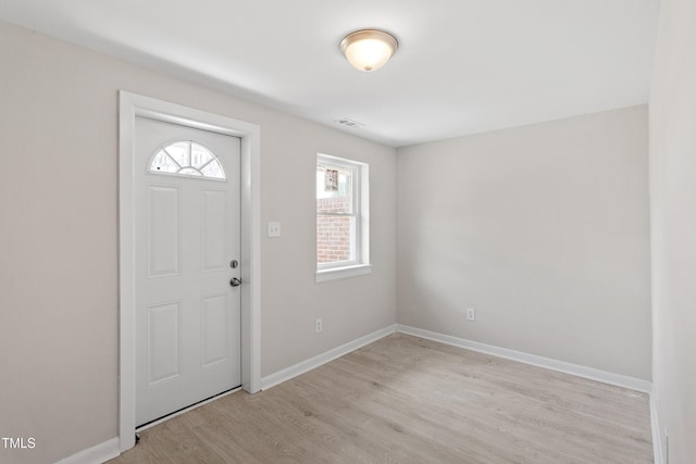 2705 Crest St Unit 3, Durham, NC 27705 - foyer entrance with light wood finished floors and baseboards