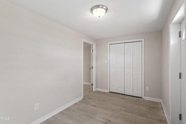 2705 Crest St Unit 3, Durham, NC 27705 - unfurnished bedroom featuring light wood-type flooring and a closet