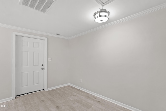 2705 Crest St Unit 3, Durham, NC 27705 - spare room with light wood-style floors, ornamental molding, and attic access