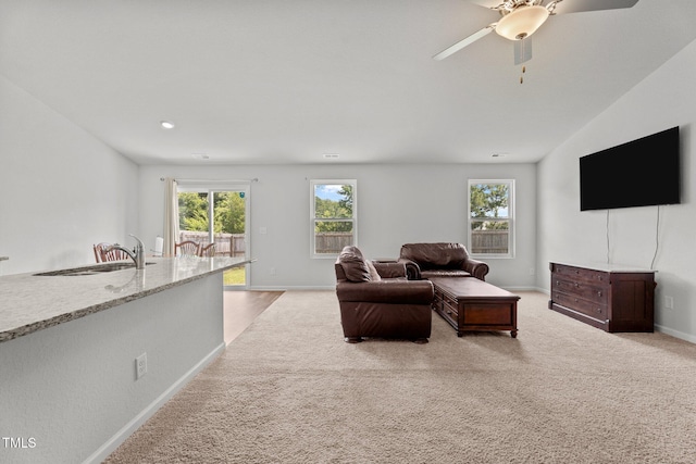 764 Frosty Way, Zebulon, NC 27597 - living room featuring light colored carpet and ceiling fan