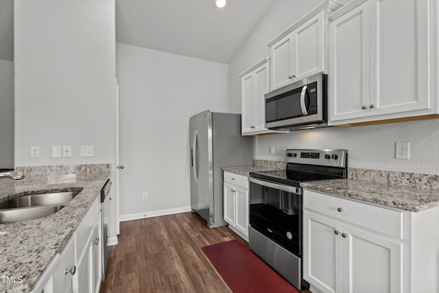 764 Frosty Way, Zebulon, NC 27597 - kitchen with stainless steel appliances, dark wood-style floors, white cabinetry, and light stone countertops