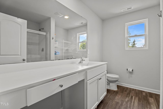 764 Frosty Way, Zebulon, NC 27597 - bathroom with vanity, a shower with door, wood finished floors, and recessed lighting