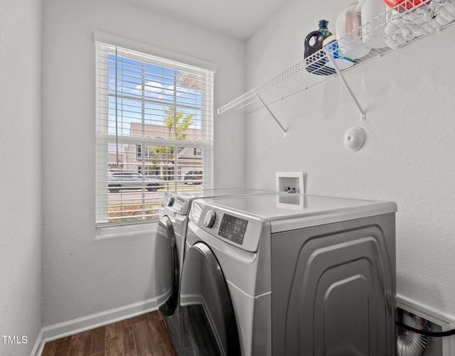 764 Frosty Way, Zebulon, NC 27597 - washroom featuring separate washer and dryer and dark wood-style flooring