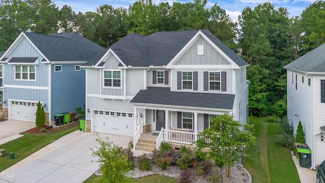 425 Cahors Trl, Holly Springs, NC 27540 - view of front of house featuring board and batten siding, covered porch, a shingled roof, driveway, and a garage