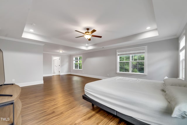 425 Cahors Trl, Holly Springs, NC 27540 - bedroom with a tray ceiling, ornamental molding, wood finished floors, recessed lighting, and a ceiling fan