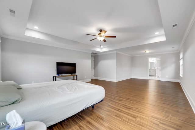 425 Cahors Trl, Holly Springs, NC 27540 - bedroom with a tray ceiling, wood finished floors, recessed lighting, ornamental molding, and a ceiling fan