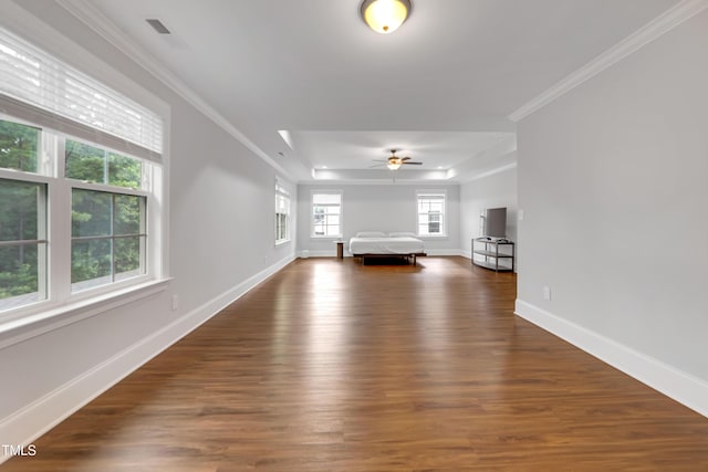 425 Cahors Trl, Holly Springs, NC 27540 - unfurnished living room featuring dark wood finished floors, a raised ceiling, ornamental molding, and a ceiling fan