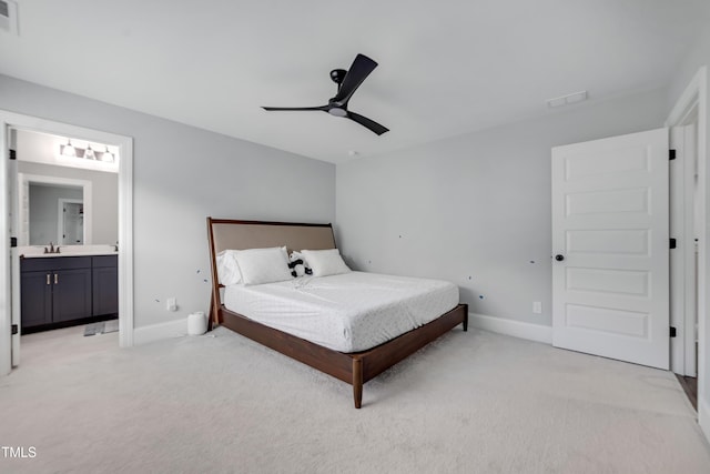 425 Cahors Trl, Holly Springs, NC 27540 - bedroom with light colored carpet, connected bathroom, and ceiling fan