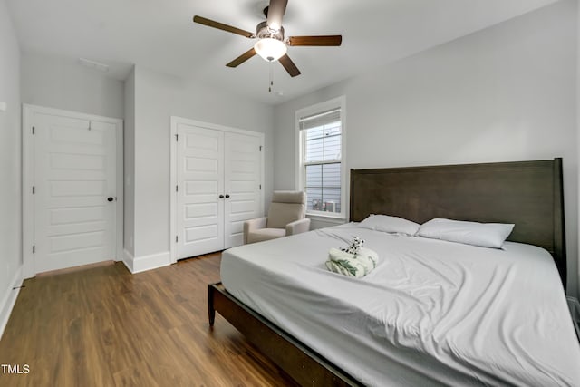 425 Cahors Trl, Holly Springs, NC 27540 - bedroom with wood finished floors, a closet, and a ceiling fan