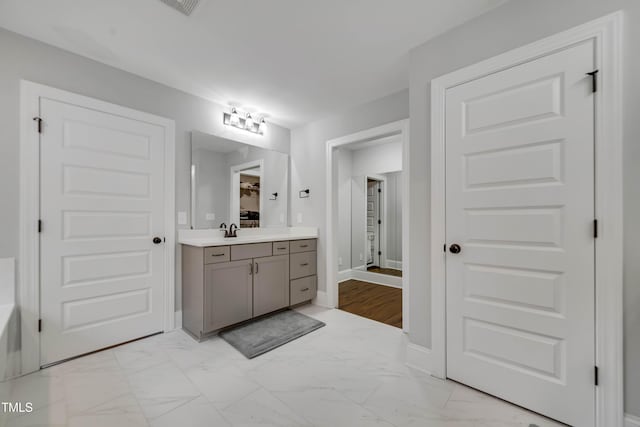 425 Cahors Trl, Holly Springs, NC 27540 - bathroom featuring vanity and marble look tiles