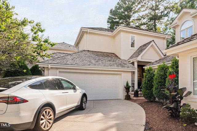 781 Crabtree Crossing Pkwy, Cary, NC 27513 - view of front of property featuring an attached garage, concrete driveway, and stucco siding