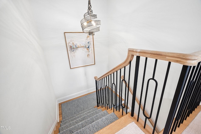 781 Crabtree Crossing Pkwy, Cary, NC 27513 - staircase with baseboards and wood finished floors
