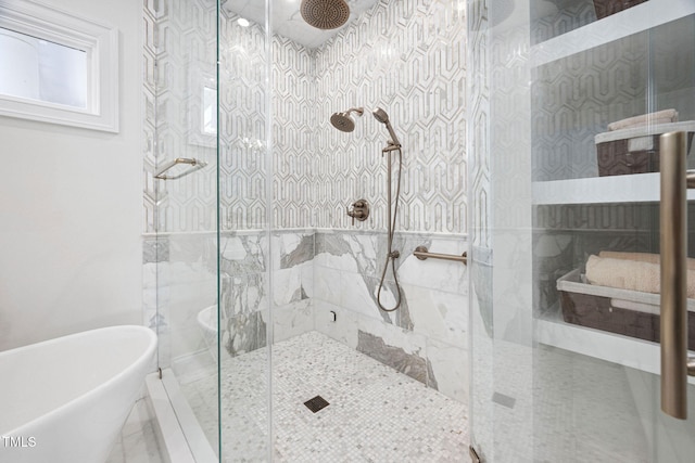 781 Crabtree Crossing Pkwy, Cary, NC 27513 - bathroom featuring a marble finish shower and a freestanding tub