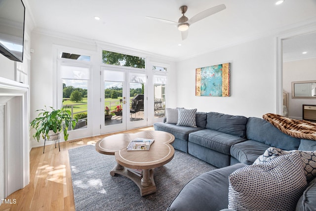 781 Crabtree Crossing Pkwy, Cary, NC 27513 - living area with french doors, ornamental molding, light wood-style flooring, ceiling fan, and recessed lighting