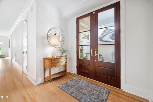 781 Crabtree Crossing Pkwy, Cary, NC 27513 - entryway featuring light wood finished floors, ornamental molding, and french doors