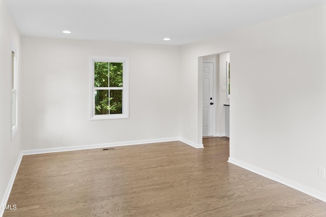 310 E Pilot St, Durham, NC 27707 - empty room featuring wood finished floors and recessed lighting