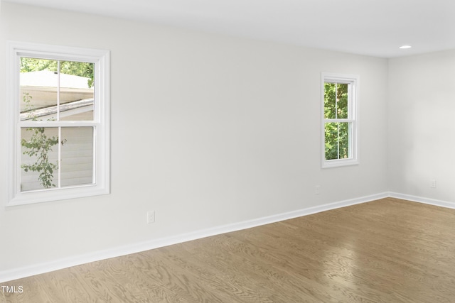 310 E Pilot St, Durham, NC 27707 - unfurnished room with wood finished floors, plenty of natural light, and recessed lighting