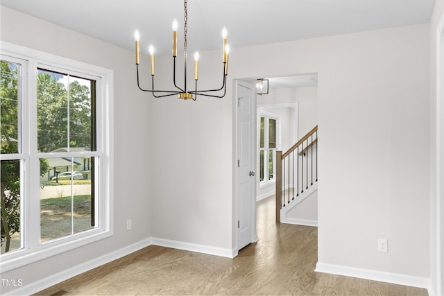 310 E Pilot St, Durham, NC 27707 - unfurnished room with a chandelier and wood finished floors