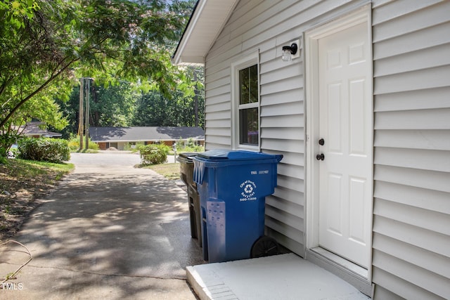 310 E Pilot St, Durham, NC 27707 - doorway to property with driveway and a patio