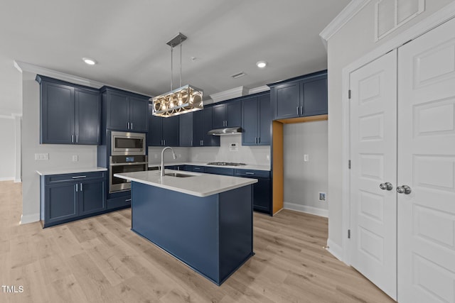 1400 Gathering Park Cir Unit 302, Cary, NC 27519 - kitchen featuring appliances with stainless steel finishes, under cabinet range hood, light countertops, a chandelier, and recessed lighting