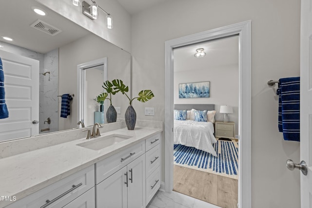1400 Gathering Park Cir Unit 302, Cary, NC 27519 - bathroom featuring vanity, a shower, marble finish flooring, and ensuite bath