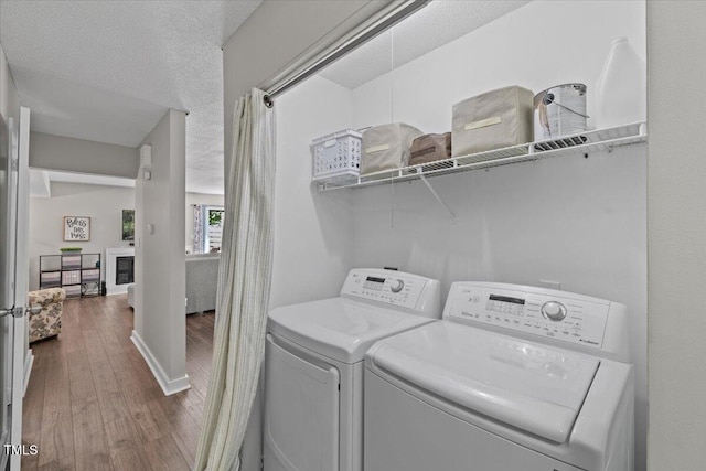 18 Willow Bridge Dr, Durham, NC 27707 - washroom with wood finished floors and washing machine and dryer