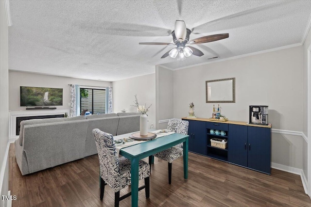 18 Willow Bridge Dr, Durham, NC 27707 - dining space featuring a textured ceiling, a ceiling fan, dark wood-style flooring, and ornamental molding