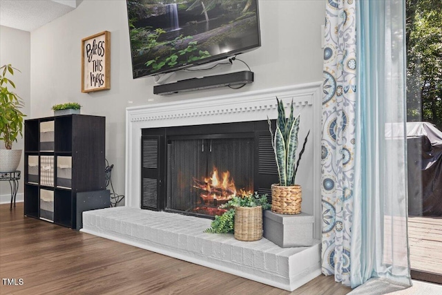 18 Willow Bridge Dr, Durham, NC 27707 - detailed view of wood finished floors and a brick fireplace