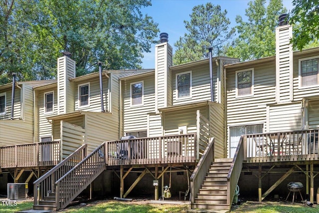 18 Willow Bridge Dr, Durham, NC 27707 - back of house with stairs, a chimney, and a wooden deck