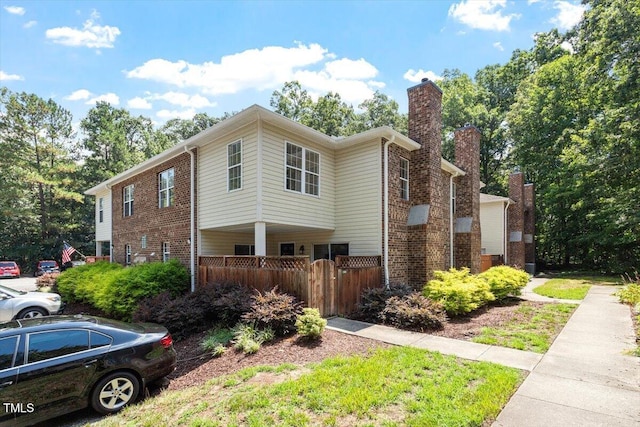 449 Summerwalk Cir, Chapel Hill, NC 27517 - view of side of home with brick siding and a chimney