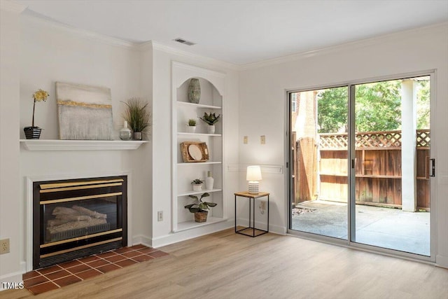 449 Summerwalk Cir, Chapel Hill, NC 27517 - living area with built in features, wood finished floors, crown molding, and a tile fireplace