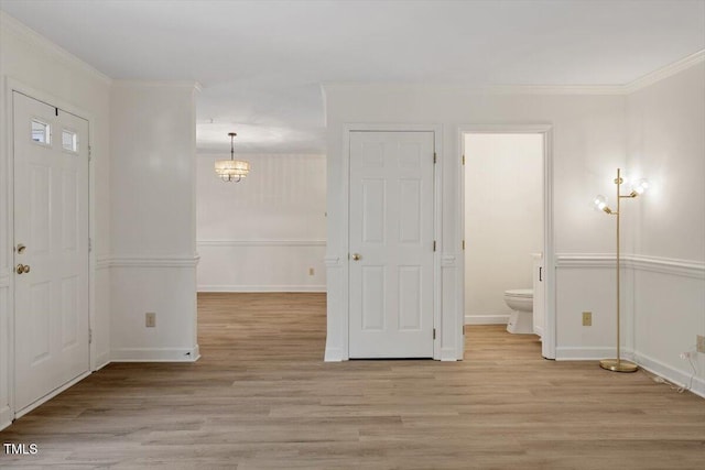 449 Summerwalk Cir, Chapel Hill, NC 27517 - foyer entrance with a chandelier, light wood-style flooring, and crown molding