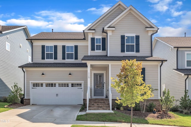 115 Circle City Way, Pittsboro, NC 27312 - view of front of property featuring a garage, driveway, and roof with shingles