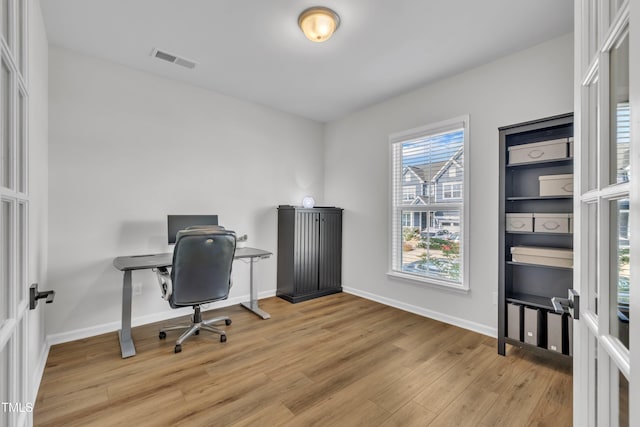 115 Circle City Way, Pittsboro, NC 27312 - home office with light wood-style flooring and baseboards