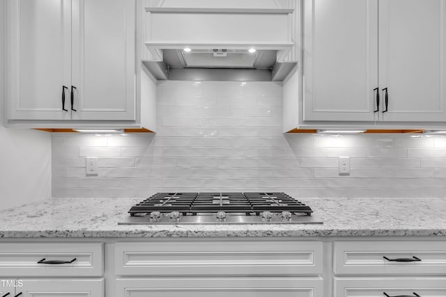 115 Circle City Way, Pittsboro, NC 27312 - kitchen with stainless steel gas cooktop, premium range hood, and white cabinets