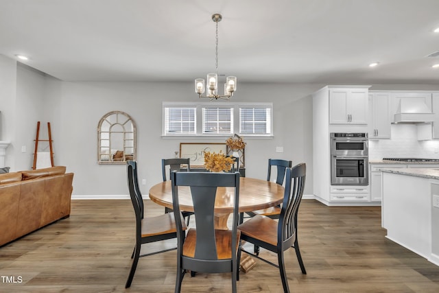 115 Circle City Way, Pittsboro, NC 27312 - dining space with a chandelier, recessed lighting, and dark wood-type flooring