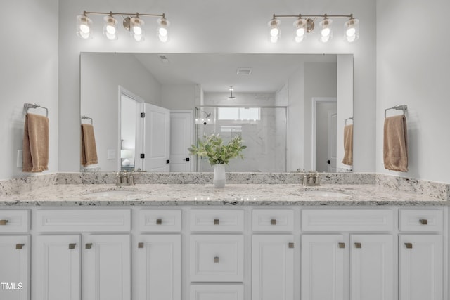 115 Circle City Way, Pittsboro, NC 27312 - bathroom featuring a marble finish shower and double vanity