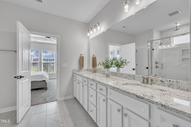 115 Circle City Way, Pittsboro, NC 27312 - bathroom with double vanity, a marble finish shower, marble finish flooring, and ensuite bath