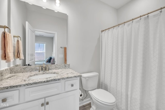 115 Circle City Way, Pittsboro, NC 27312 - full bathroom featuring vanity, wood finished floors, and a shower with curtain