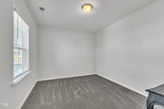 115 Circle City Way, Pittsboro, NC 27312 - empty room with dark carpet and baseboards