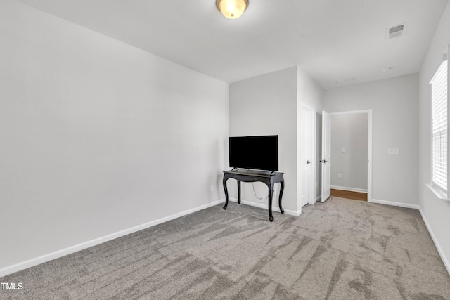 115 Circle City Way, Pittsboro, NC 27312 - unfurnished living room with carpet flooring and healthy amount of natural light