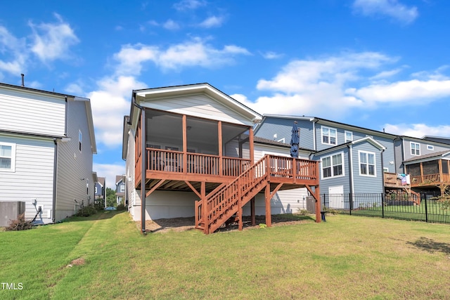115 Circle City Way, Pittsboro, NC 27312 - back of property featuring a sunroom, stairs, and a wooden deck