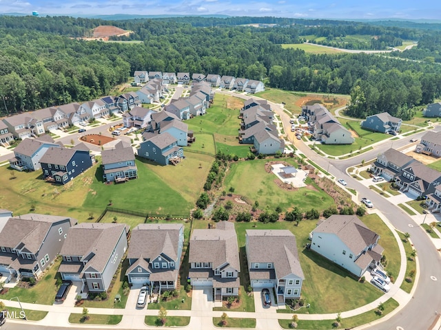 115 Circle City Way, Pittsboro, NC 27312 - aerial view of property and surrounding area featuring nearby suburban area and a forest