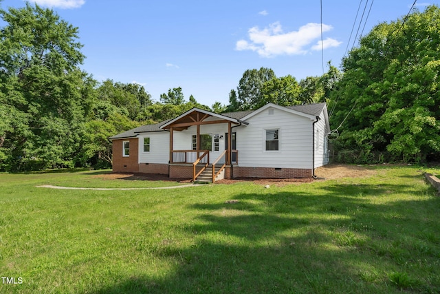 1907 Wilkins St, Burlington, NC 27217 - back of property with crawl space and a lawn
