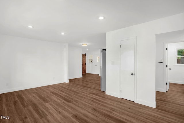1907 Wilkins St, Burlington, NC 27217 - spare room featuring wood finished floors and recessed lighting