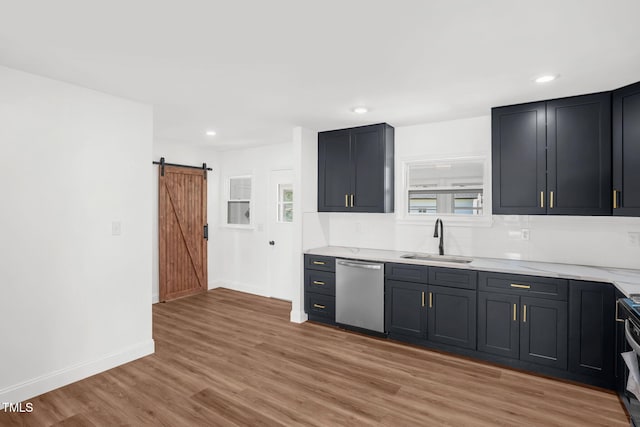 1907 Wilkins St, Burlington, NC 27217 - kitchen with stainless steel dishwasher, a barn door, light wood-type flooring, recessed lighting, and stove